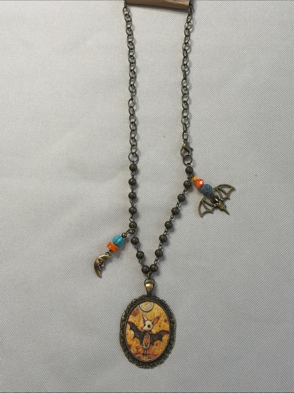 Vintage-Inspired Bat Pendant Necklace with Orange and Turquoise Beads